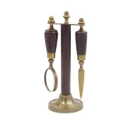 Brass paper knife and magnifying glass on a stand in a leather frame