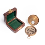 Brass compass in wooden box