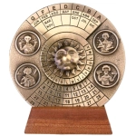 Brass perpetual calendar on a wooden base