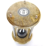 Brass and wooden hourglass with black sand