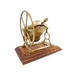 Brass rotating bell on a wooden base