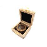 Brass compass with retractable magnifying glass in a wooden box