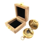 Brass compass with sundial in a wooden box