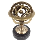 Brass astrolabe on a black stone base