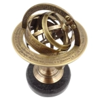 Brass astrolabe on a black stone base