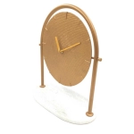 Round metal clock on a marble base