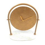 Round metal clock on a marble base