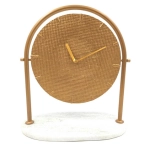 Round metal clock on a marble base