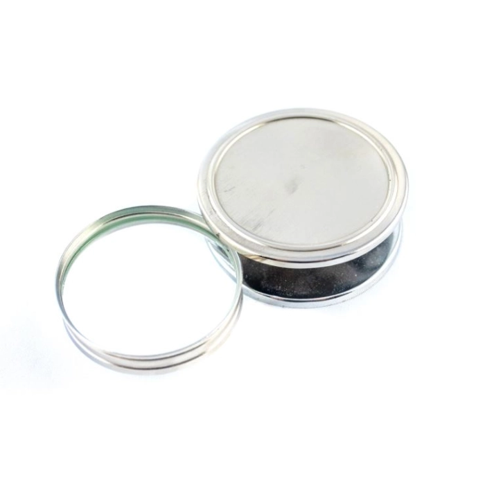 Folding magnifier in a steel housing