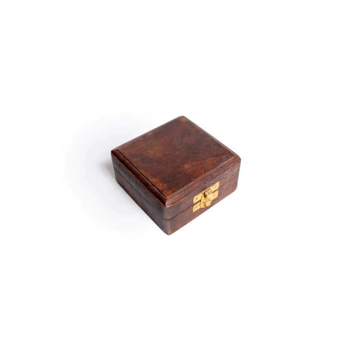 Brass compass in wooden box