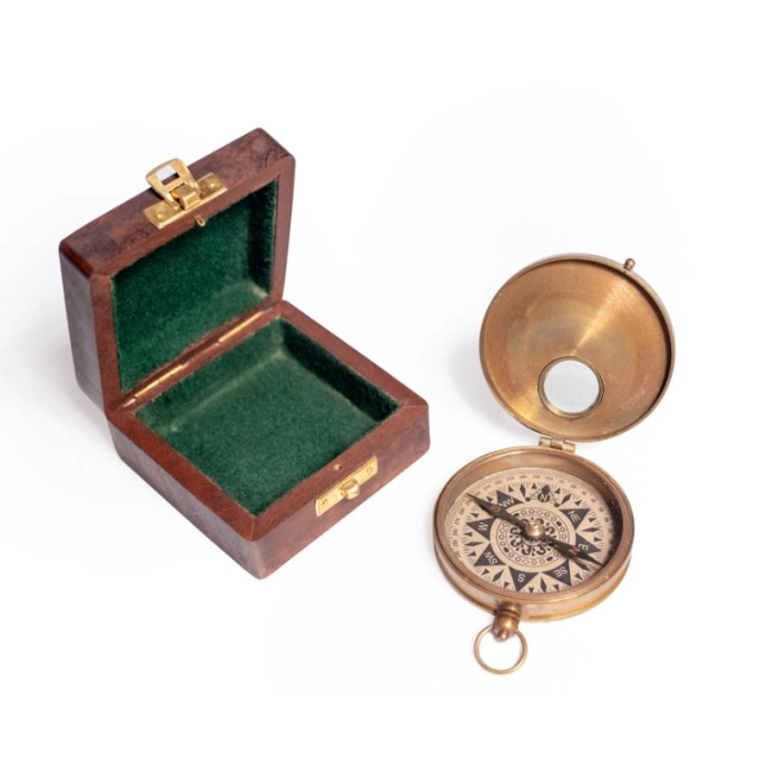 Brass compass in wooden box