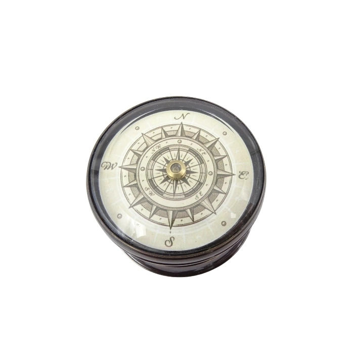 Brass compass with a floating shield