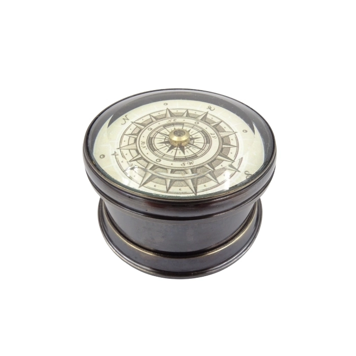 Brass compass with a floating shield
