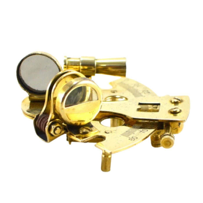 A small brass sextant in a wooden box