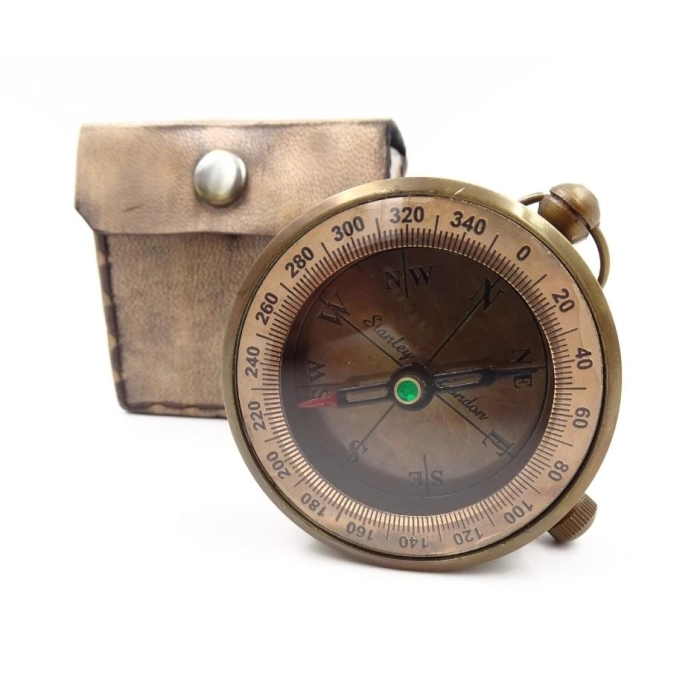 Brass compass in a leather case
