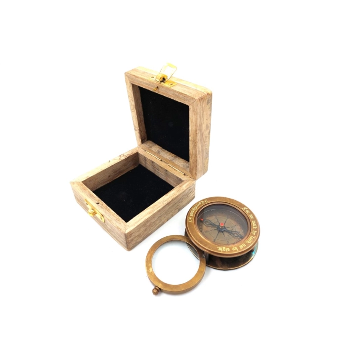 Brass compass with retractable magnifying glass in a wooden box