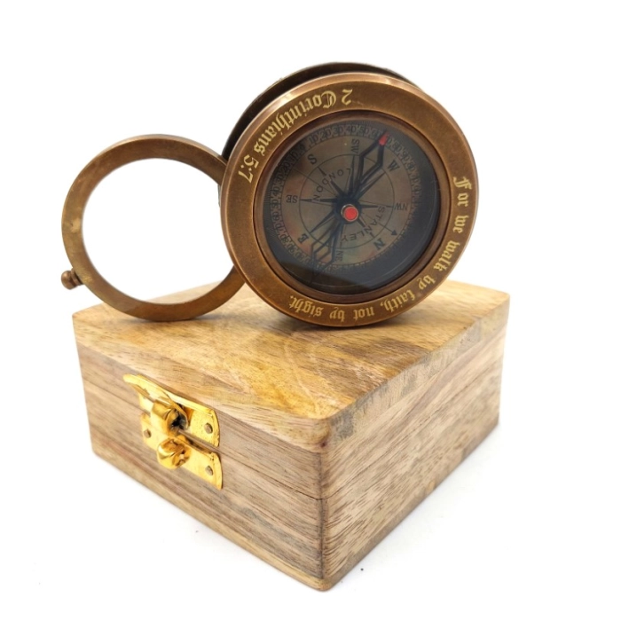 Brass compass with retractable magnifying glass in a wooden box