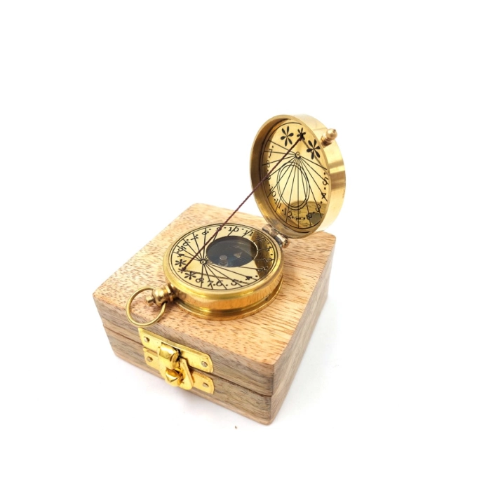 Brass compass with sundial in a wooden box
