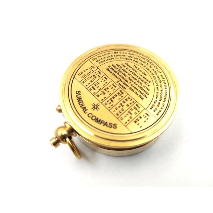 Brass compass with sundial in a wooden box