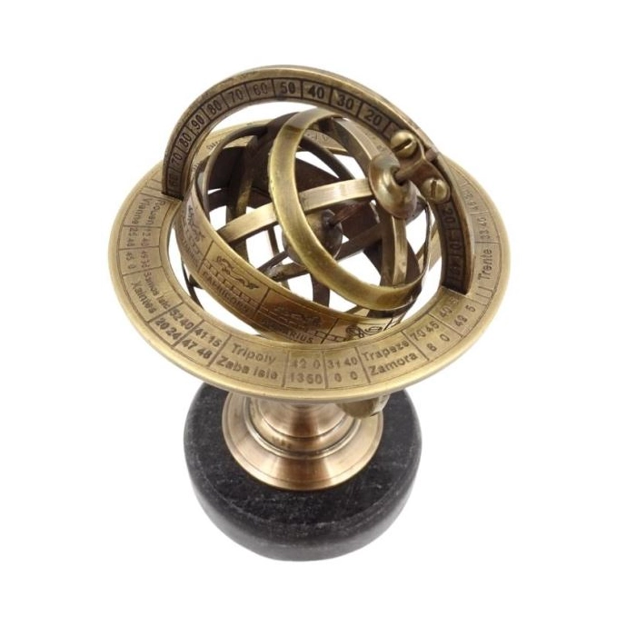 Brass astrolabe on a black stone base