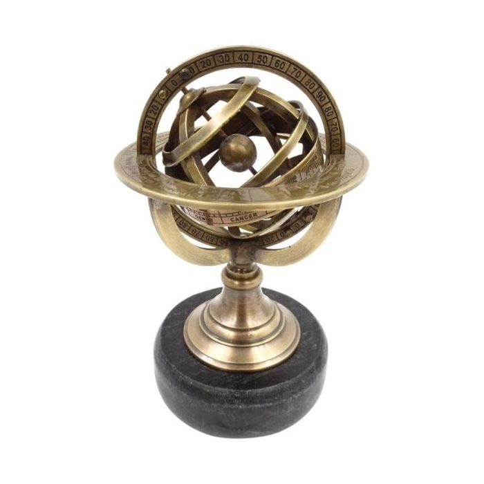 Brass astrolabe on a black stone base
