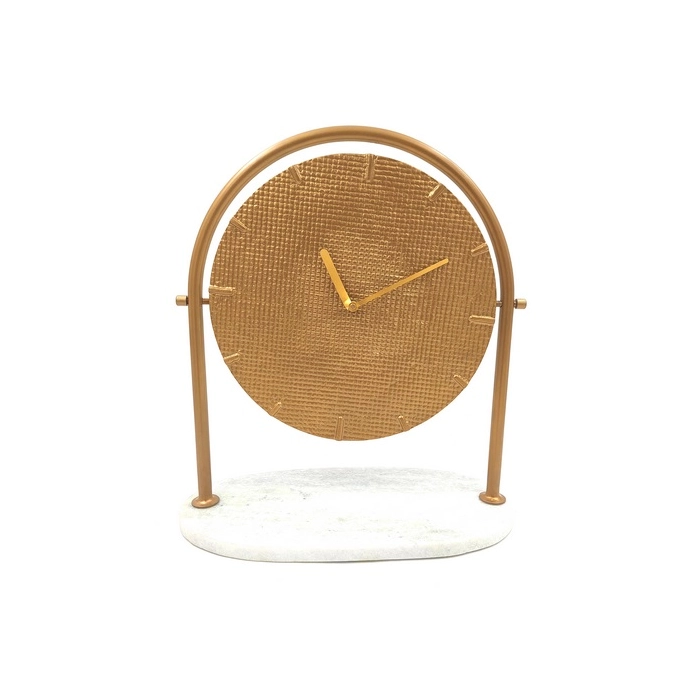 Round metal clock on a marble base