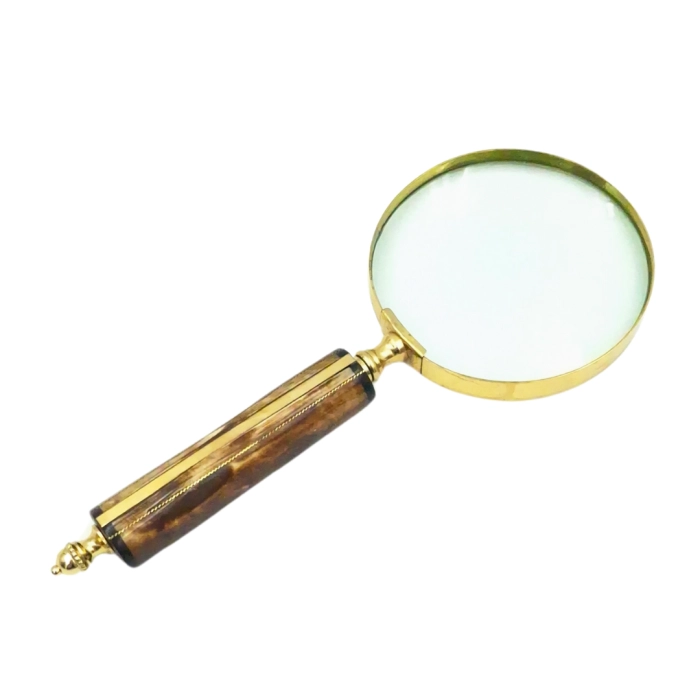 Magnifying glass in a brass frame with a bone handle