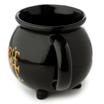 A ceramic cup of a witch's cauldron