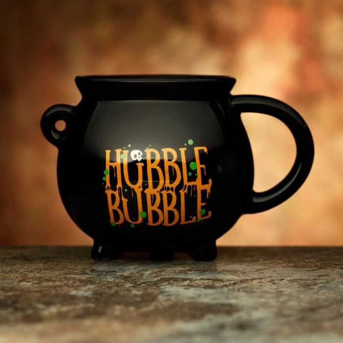 A ceramic cup of a witch's cauldron