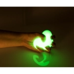 White anti-stress ball glowing in the dark