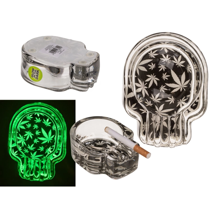 The glass ashtray glows in the dark - marijuana leaves